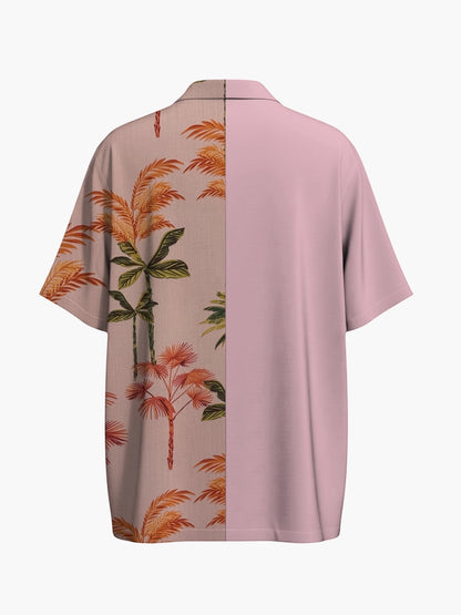 Atsignatsign Official unisex oversized Hawaiian shirt in pink with a split design: one half features a tropical palm tree print, the other is solid pink.