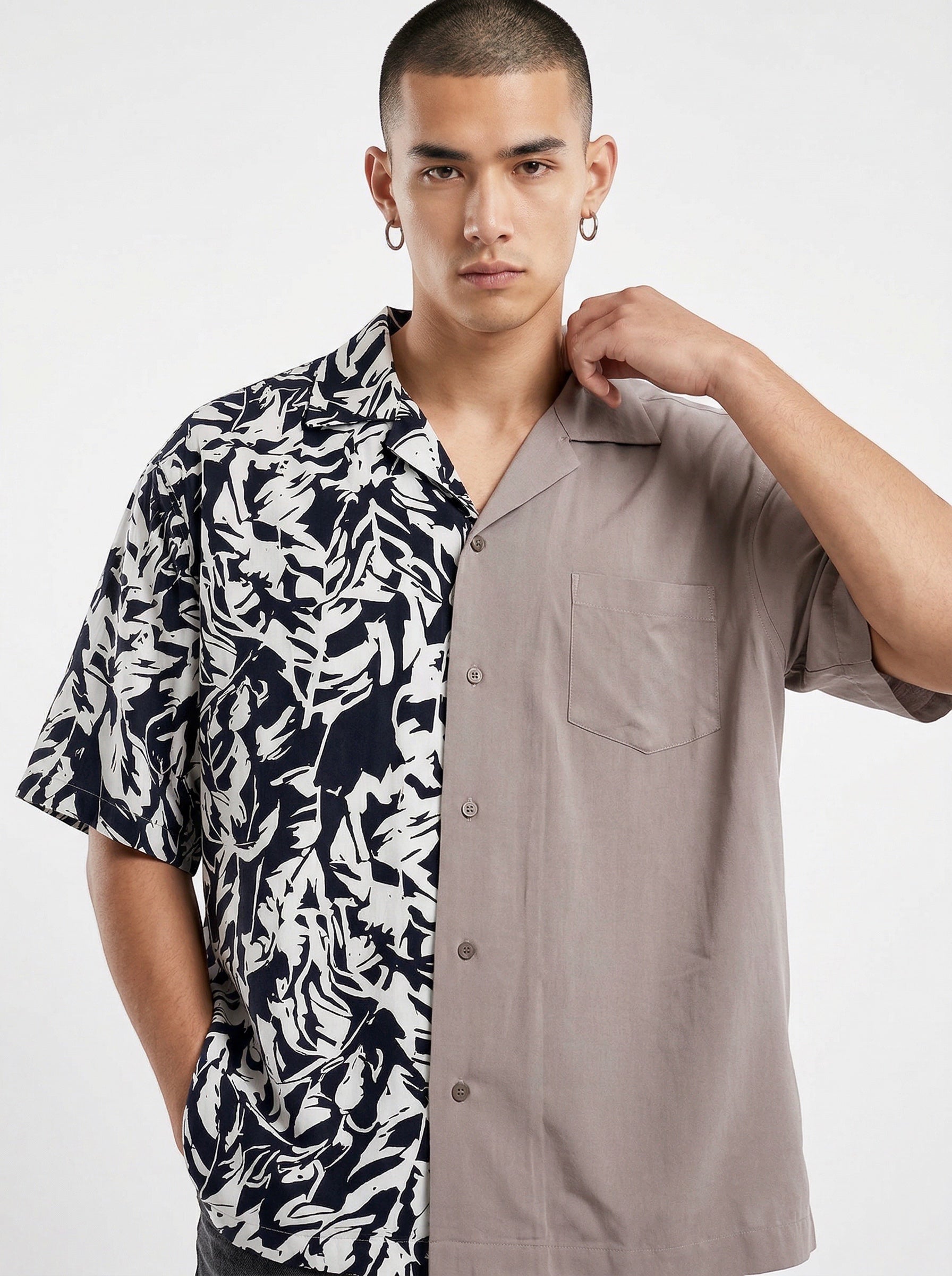 Atsignatsign Official unisex oversized Hawaiian shirt with a split design: navy and white abstract print on the left, solid taupe on the right. 100% rayon.