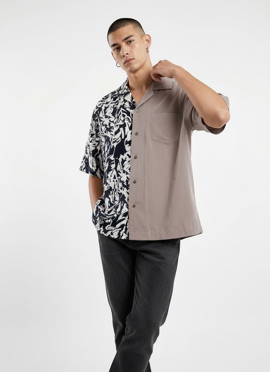 Atsignatsign Official unisex oversized Hawaiian shirt in taupe and navy with a contrasting abstract leaf print on the left side. Made from 100% rayon.